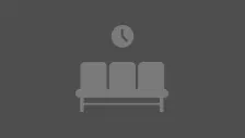 graues Icon mit drei Wartezimmersitzen und einer Uhr darüber auf schwarzem Bildschirm